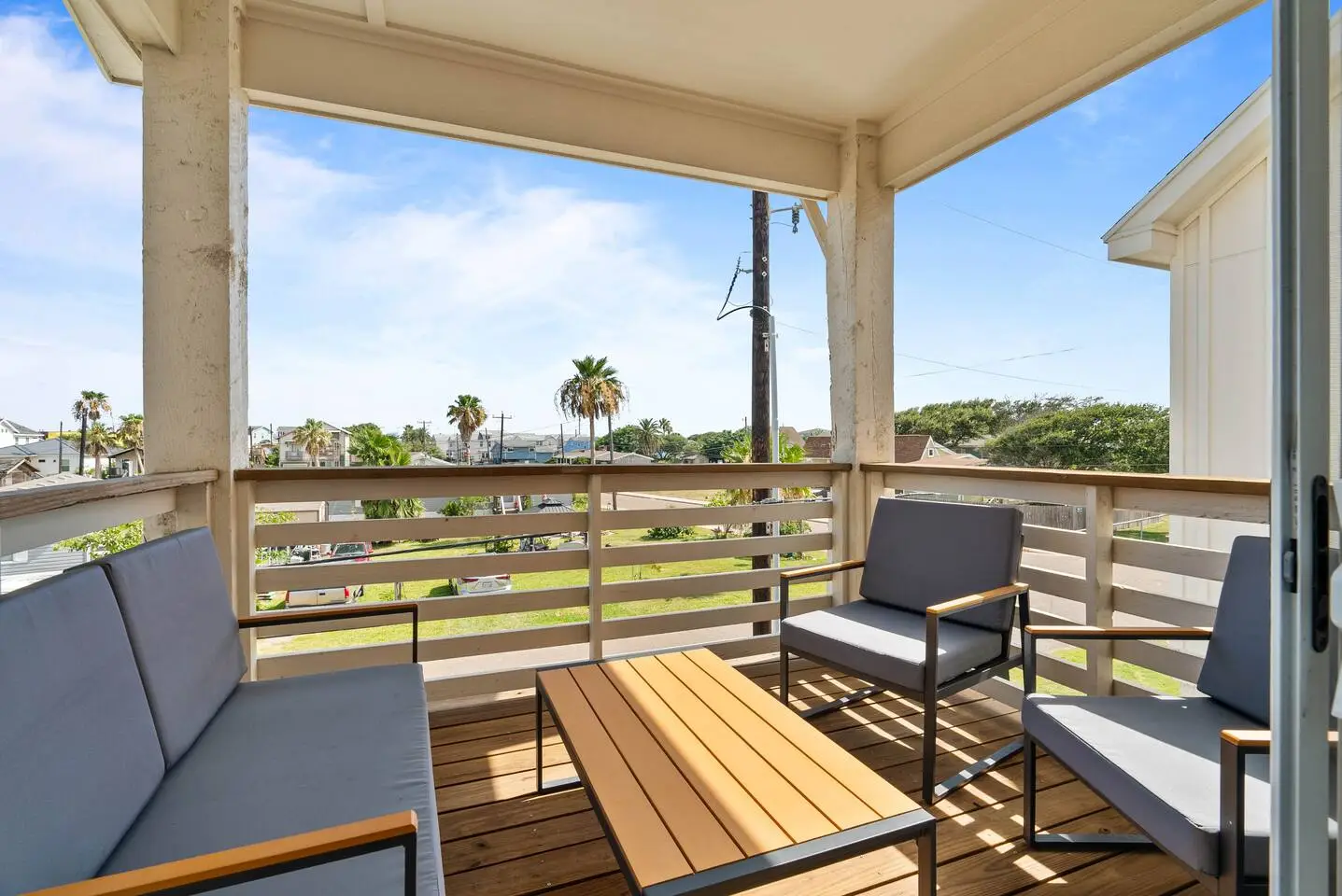 Covered balcony with comfy seating and views, giving the perfect spot to relax with your morning coffee or evening drink.
